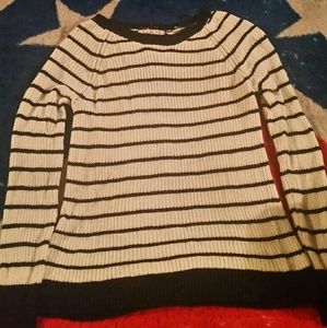 A long sleeve dark blue and white striped sweater